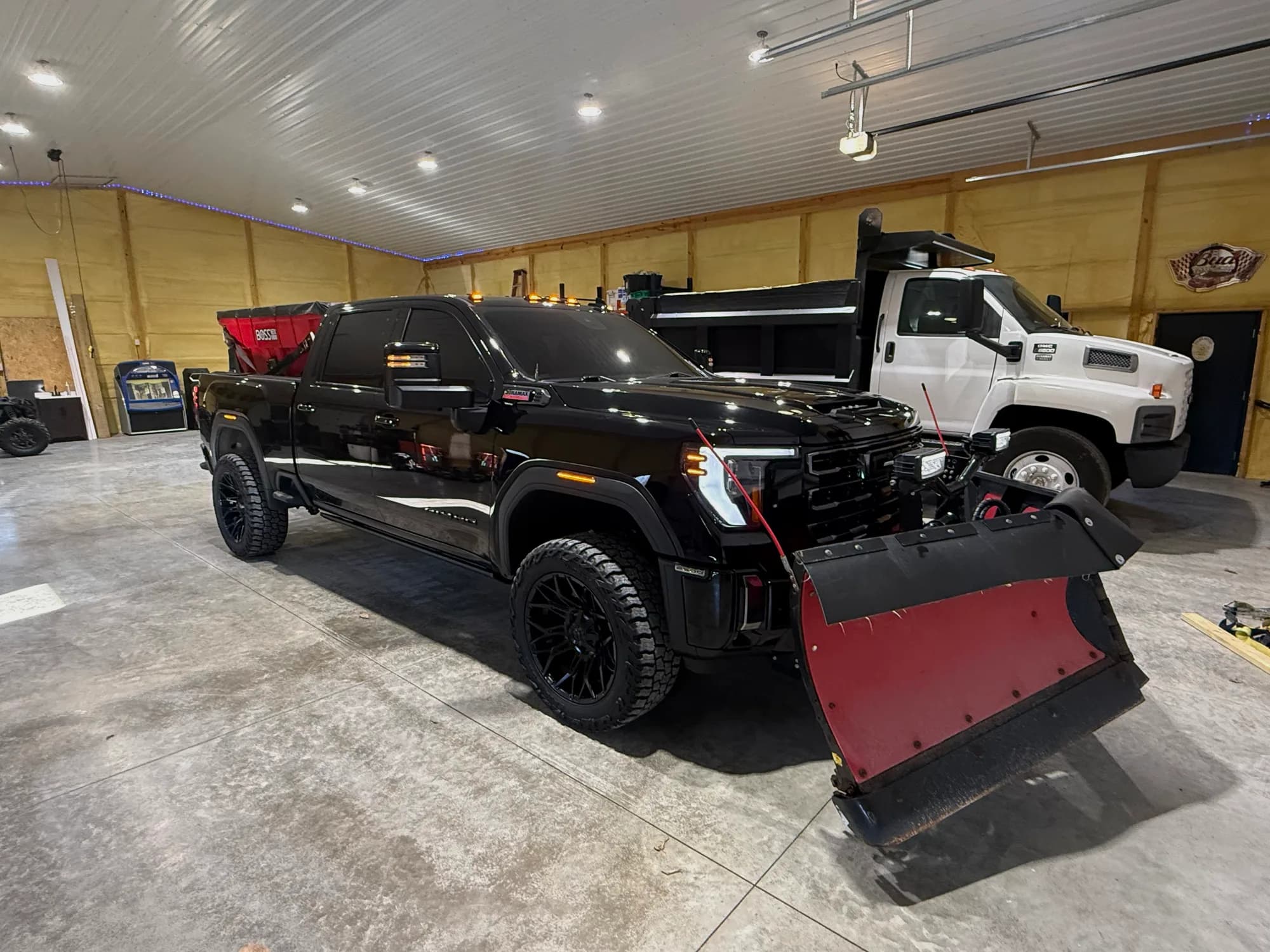 Outdoor Muscle plow truck and skid steer ready for work